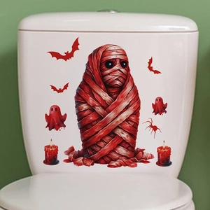 Close-up of Halloween mummy and bat PVC wall stickers on white toilet tank surface