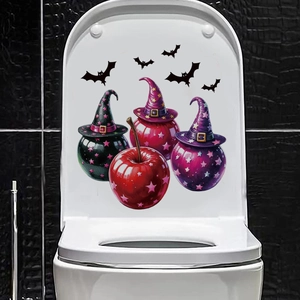 Close-up of Halloween toilet lid sticker with colorful witch-themed graphics and black bats