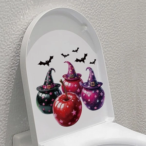 Detail of Halloween magic apple stickers with wizard hats and bats on a toilet lid