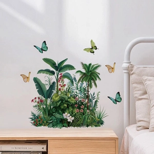 Tropical rainforest wall stickers with green leaves and colorful butterflies on bedroom wall