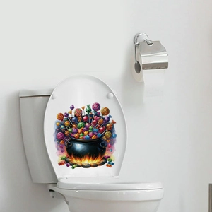Detail of Halloween cauldron candy sticker mockup on a white toilet lid in a clean bathroom