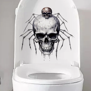 Creepy skeleton skull and spider legs sticker on a white ceramic toilet lid for Halloween