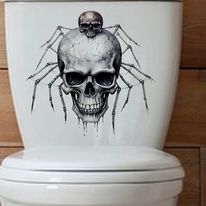 Detail of spooky skeleton toilet sticker with hand-drawn spider-like legs on white ceramic