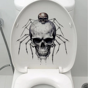 Detail of Halloween toilet sticker featuring a gothic skull with spider legs on a lid