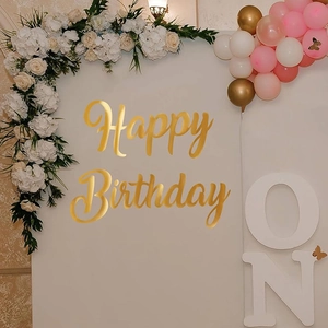 Detailed close-up of metallic gold Happy Birthday wall lettering for luxury party decor