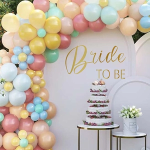 Macro view of macaron latex balloons in flower shapes for Bride To Be party decor