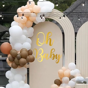 Neutral tones balloon arch kit with gold Oh Baby sign for gender reveal party