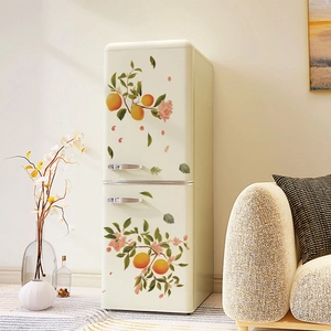 Retro cream mini fridge with floral orange decals in a cozy living room setting