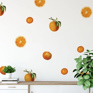 Vivid orange fruit wall decals for home decor shown in a bright living room setting