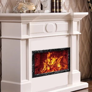 Close-up of white fireplace mantel with embossed patterns and realistic LED flame display