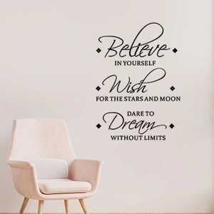 Detail of inspirational black vinyl wall decals featuring motivational quotes on white wall