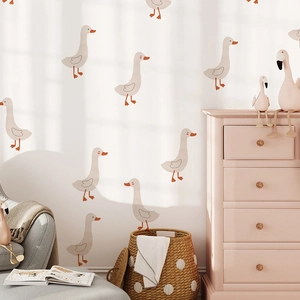 Detail view of cartoon duck wall stickers in a cozy Boho style nursery and bedroom