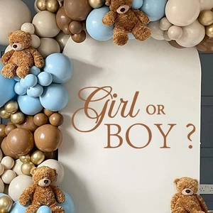 Detail of gender reveal party arch with Girl or Boy lettering and brown teddy bears