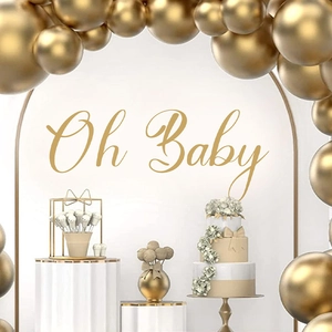 Golden Oh Baby wall sticker and balloons on white arch backdrop for luxury party decor