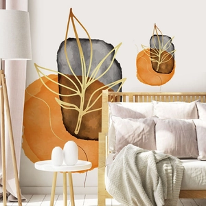 Detail of geometric leaf wall sticker with golden lines and orange watercolor shapes