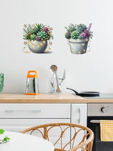 Detail of self-adhesive wall decals featuring succulent plants with warm LED light effects