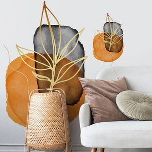 Abstract geometric leaf wall decals in gold and orange for modern living room decor