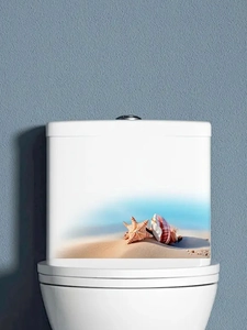 Detail of waterproof starfish and seashell sticker on white toilet water tank lid