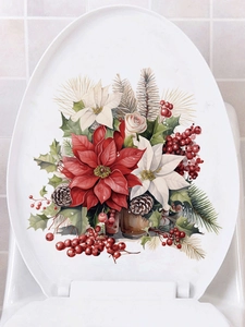 Detailed view of Christmas poinsettia flower stickers applied on a white toilet lid