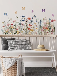Détail de stickers muraux fleurs sauvages et papillons aquarelle sur mur blanc