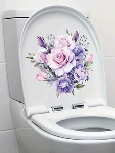 Detail of floral heart-shaped toilet sticker with purple and pink roses on ceramic lid