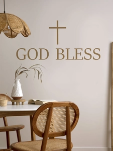 Detailed view of God Bless cross wall decal on a warm minimalist home background