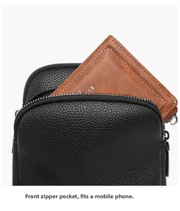 Macro detail of black lychee leather crossbody bag with front zipper pocket and wallet