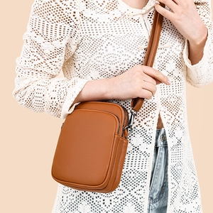 Mini retro dark brown leather crossbody bag with dual zippers and adjustable strap