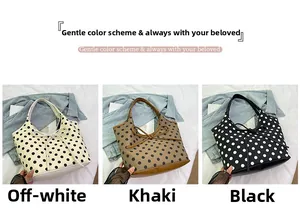 Three nylon tote bags in cream, khaki, and black with polka dots and bow detailing