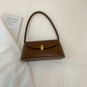 Minimalist deep brown matte leather baguette bag with a stylish golden metal buckle