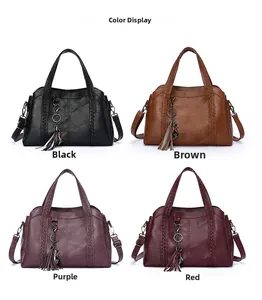 Detail view of vintage PU leather handbags in four colors with woven handles and tassels