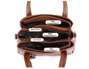 Macro view of the multi-compartment interior and lychee pattern leather of the brown tote bag