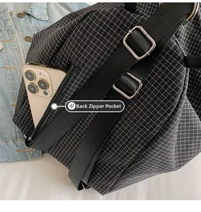 Detail of checkered backpack featuring back anti-theft zipper pocket for smartphone