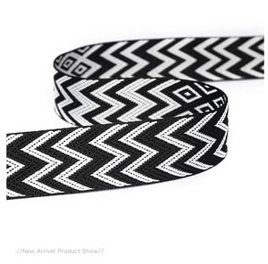 Close-up detail of high-quality black and white woven geometric pattern shoulder strap
