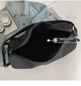 Interior details of large black and white checkered dumpling bag with iPad and accessories