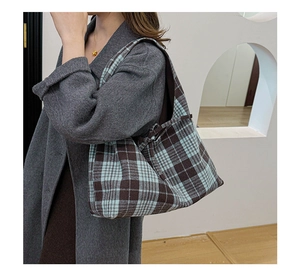 Close-up of retro plaid pattern texture on a large capacity tote bag for autumn