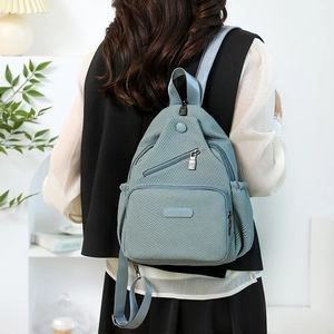 Sac à dos bleu clair en toile pour femme avec grande capacité et tissu résistant