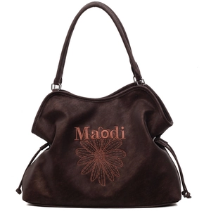 Brown suede tote bag with sunflower embroidery and Maodi lettering on white background