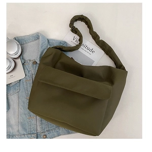 Olive green nylon shoulder bag with pleated straps and spacious front pocket for commuting