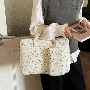 Corduroy laptop shoulder bag with heart bow print and matching small storage pouch