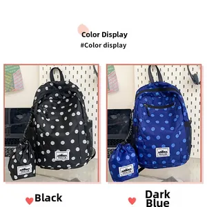 Polka dot backpacks in black and navy blue with matching drawstring storage pouches