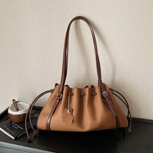 Vintage brown lychee grain leather bucket bag with drawstring and floral charm