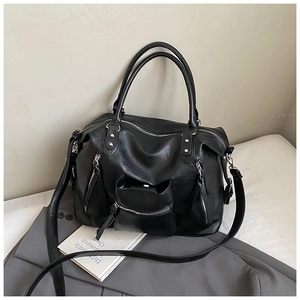 Black PU leather tote bag with multiple zip pockets and silver rivets for daily commuting