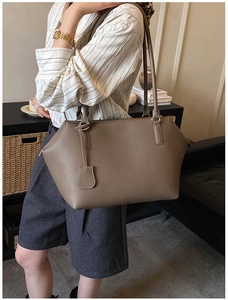 Deep khaki calfskin tote bag with litchi texture and slender straps on shoulder