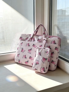 Pink velvet tote bag with butterfly print and matching small zipper pouch on a window sill