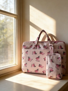 Pink velvet shoulder bag with butterfly print and matching small accessory pouch