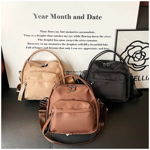 Three minimalist nylon crossbody backpacks in beige, brown and black for daily commute