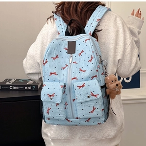 Sac à dos bleu pour femme avec motif nœud texture gaufrée et breloque peluche