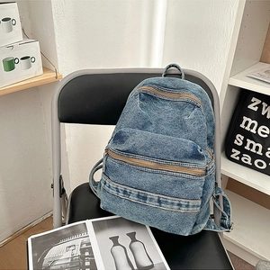 Sac à dos vintage en denim délavé bleu foncé avec double fermeture éclair et style rétro