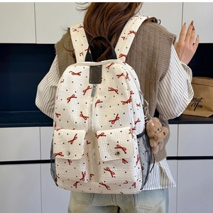 Sac à dos en tissu gaufré blanc avec motifs nœuds rouges et charmant ours en peluche